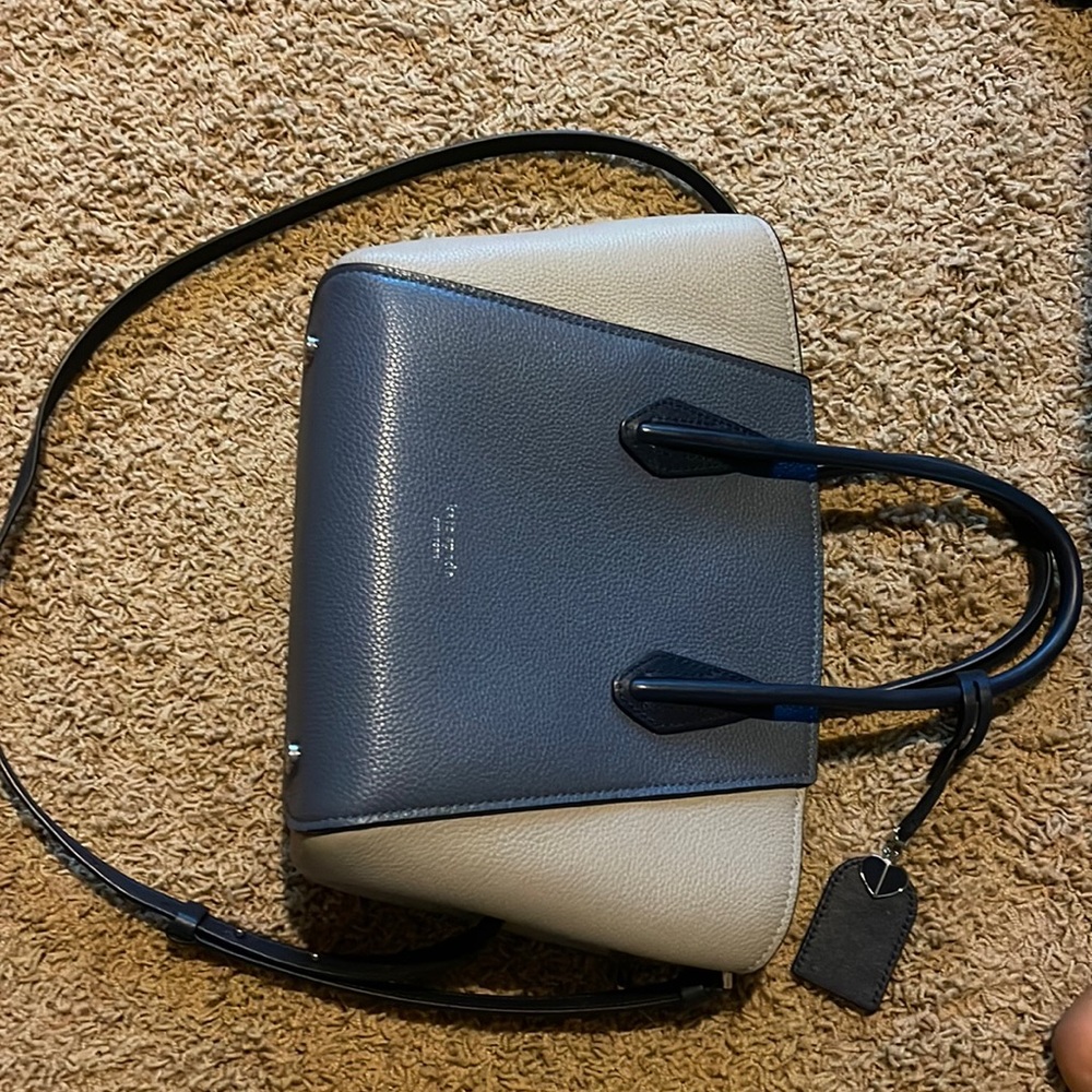 Brand new. Lightly used. Kate Spade. Ex BF purchase.